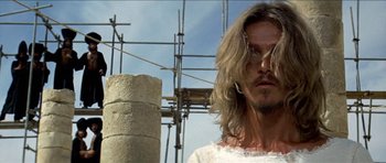 Movie still from “Jesus Christ Superstar” (1973), directed by Norman Jewison – A person with long blonde hair; Close Up shot, Low angle