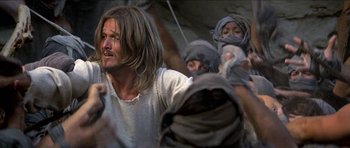 Movie still from “Jesus Christ Superstar” (1973), directed by Norman Jewison – A group of people standing in a room; Medium shot, Low angle