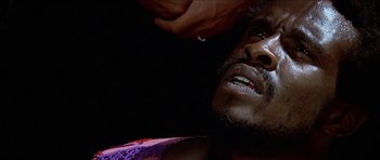 Movie still from “Jesus Christ Superstar” (1973), directed by Norman Jewison – A person with a hand on his head; Close Up shot, Low angle