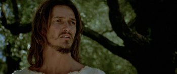 Movie still from “Jesus Christ Superstar” (1973), directed by Norman Jewison – A person with long hair and a beard; Close Up shot, Low angle