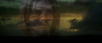Movie still from “Jesus Christ Superstar” (1973), directed by Norman Jewison – A man with long hair is looking at the sky; Close Up shot, Low angle