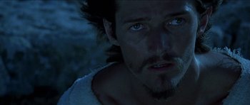 Movie still from “Jesus Christ Superstar” (1973), directed by Norman Jewison – A person wearing a white shirt; Close Up shot, Over the shoulder angle