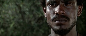 Movie still from “Jesus Christ Superstar” (1973), directed by Norman Jewison – A person's face with trees in the background; Close Up shot, Low angle