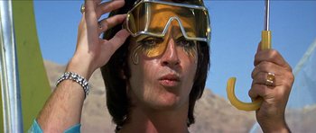 Movie still from “Jesus Christ Superstar” (1973), directed by Norman Jewison – A man with a face paint and goggles on; Close Up shot, Low angle