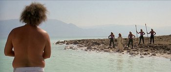 Movie still from “Jesus Christ Superstar” (1973), directed by Norman Jewison – A man and a woman standing on a rocky shore; Wide shot, Over the shoulder angle