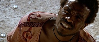 Movie still from “Jesus Christ Superstar” (1973), directed by Norman Jewison – A man's face and chest; Close Up shot, Low angle