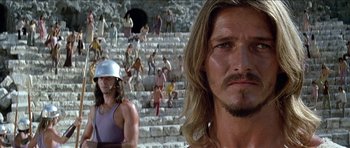 Movie still from “Jesus Christ Superstar” (1973), directed by Norman Jewison – A person with long hair wearing a helmet; Close Up shot, Low angle