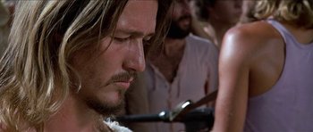 Movie still from “Jesus Christ Superstar” (1973), directed by Norman Jewison – A person cutting his hair; Close Up shot, Low angle