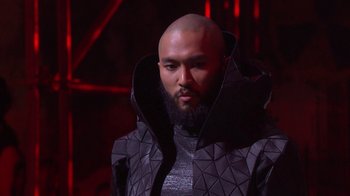Movie still from “Jesus Christ Superstar Live in Concert” (2018), directed by Alex Rudzinski – A man with a beard and a black jacket; Close Up shot, Low angle