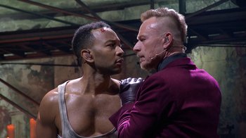 Movie still from “Jesus Christ Superstar Live in Concert” (2018), directed by Alex Rudzinski – A man and a man in a boxing ring; Close Up shot, Over the shoulder angle