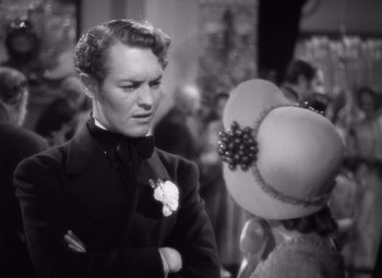 Movie still from “Jezebel” (1938), directed by William Wyler – A black and white photo of a man and a woman; Close Up shot, Over the shoulder angle