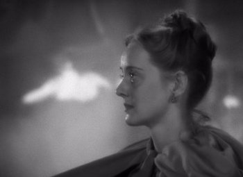 Movie still from “Jezebel” (1938), directed by William Wyler – A black - and - white photo of a woman's face; Close Up shot, High angle