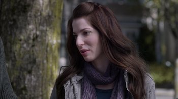 Movie still from “Turkey Hollow” (2015), directed by Kirk R. Thatcher – A person with long brown hair; Close Up shot, Over the shoulder angle
