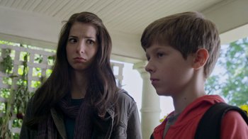 Movie still from “Turkey Hollow” (2015), directed by Kirk R. Thatcher – A woman and a boy standing next to each other; Close Up shot, Low angle