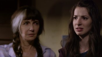 Movie still from “Turkey Hollow” (2015), directed by Kirk R. Thatcher – A woman and a woman standing next to each other; Close Up shot, Over the shoulder angle