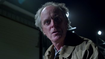 Movie still from “Turkey Hollow” (2015), directed by Kirk R. Thatcher – An older man with a gray beard is looking at the camera; Close Up shot, Low angle