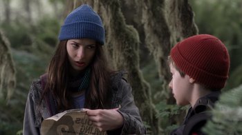 Movie still from “Turkey Hollow” (2015), directed by Kirk R. Thatcher – A woman and a boy in a wooded area looking at each other; Close Up shot, Over the shoulder angle