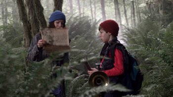 Movie still from “Turkey Hollow” (2015), directed by Kirk R. Thatcher – A boy and a girl in the woods looking at a map; Medium shot, Over the shoulder angle