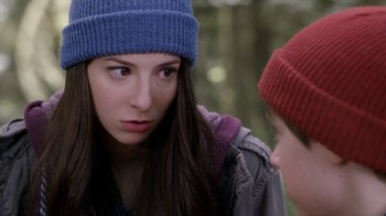 Movie still from “Turkey Hollow” (2015), directed by Kirk R. Thatcher – A woman wearing a blue hat is looking at another woman; Close Up shot, Over the shoulder angle