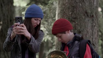 Movie still from “Turkey Hollow” (2015), directed by Kirk R. Thatcher – A woman and a young boy standing next to each other; Close Up shot, Low angle