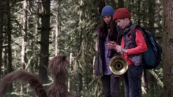 Movie still from “Turkey Hollow” (2015), directed by Kirk R. Thatcher – A boy and a girl standing next to a dog; Medium shot, Over the shoulder angle