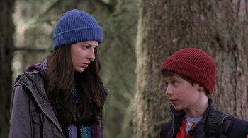 Movie still from “Turkey Hollow” (2015), directed by Kirk R. Thatcher – Two young people wearing winter hats talking to each other; Close Up shot, Over the shoulder angle