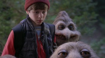 Movie still from “Turkey Hollow” (2015), directed by Kirk R. Thatcher – A young boy standing in front of a group of furry creatures; Close Up shot, Over the shoulder angle