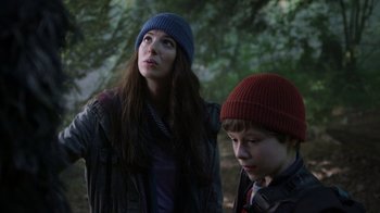 Movie still from “Turkey Hollow” (2015), directed by Kirk R. Thatcher – A woman standing next to a young boy wearing a hat; Close Up shot, Low angle