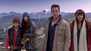 Movie still from “Turkey Hollow” (2015), directed by Kirk R. Thatcher – A man and a woman standing in front of a mountain range; Medium shot, Low angle