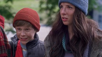 Movie still from “Turkey Hollow” (2015), directed by Kirk R. Thatcher – A woman and a young boy standing next to each other; Close Up shot, Over the shoulder angle