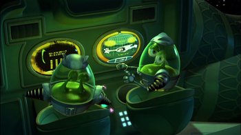 Movie still from “Jimmy Neutron: Boy Genius” (2001), directed by John A. Davis – Two cartoon characters sitting in a green room; Medium shot, High angle