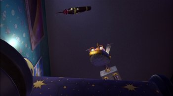 An owl is flying through the air at night