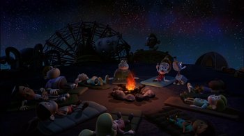 Movie still from “Jimmy Neutron: Boy Genius” (2001), directed by John A. Davis – A group of people sitting around a fire pit at night; Extreme Wide shot, High angle
