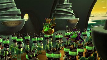 Movie still from “Jimmy Neutron: Boy Genius” (2001), directed by John A. Davis – A group of green and yellow characters in a room; Extreme Wide shot, High angle