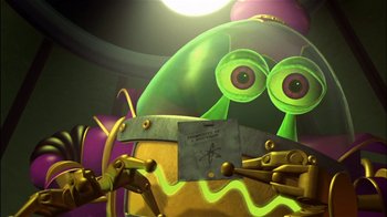 Movie still from “Jimmy Neutron: Boy Genius” (2001), directed by John A. Davis – A green cartoon character is holding a piece of paper in front of him; Close Up shot, High angle