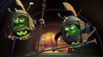 Movie still from “Jimmy Neutron: Boy Genius” (2001), directed by John A. Davis – A couple of cartoon characters are in a room; Medium shot, Low angle