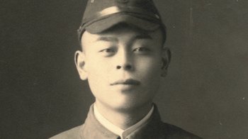 Movie still from “Jiro Dreams of Sushi” (2011), directed by David Gelb – An old photo of a man wearing a hat; Close Up shot, High angle