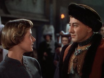 Movie still from “Joan of Arc” (1948), directed by Victor Fleming – A man and a woman talking to each other in front of a crowd; Medium shot, Over the shoulder angle