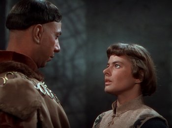 Movie still from “Joan of Arc” (1948), directed by Victor Fleming – A man and a woman standing next to each other; Close Up shot, Over the shoulder angle
