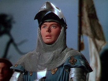 Movie still from “Joan of Arc” (1948), directed by Victor Fleming – A man wearing a chain mail helmet and a suit of armor; Close Up shot, Low angle
