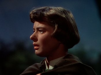 Movie still from “Joan of Arc” (1948), directed by Victor Fleming – A person with short brown hair; Close Up shot, Over the shoulder angle