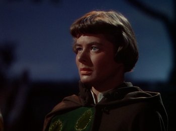 Movie still from “Joan of Arc” (1948), directed by Victor Fleming – A man in a brown and green outfit; Close Up shot, Low angle