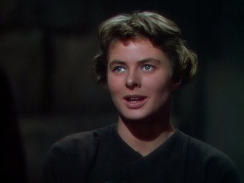 Movie still from “Joan of Arc” (1948), directed by Victor Fleming – A woman with blue eyes is looking at the camera; Close Up shot, Over the shoulder angle