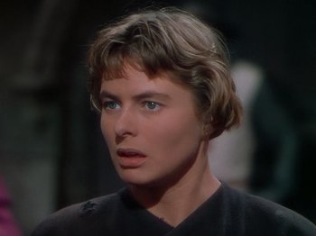 Movie still from “Joan of Arc” (1948), directed by Victor Fleming – A person with short brown hair; Close Up shot, Over the shoulder angle