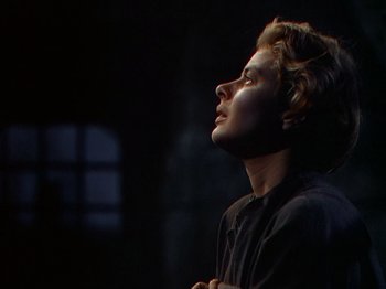 Movie still from “Joan of Arc” (1948), directed by Victor Fleming – A young man looking up into the sky; Close Up shot, Low angle