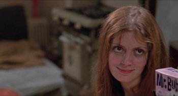 Movie still from “Joe” (1970), directed by John G. Avildsen – A person with long red hair; Close Up shot, Low angle