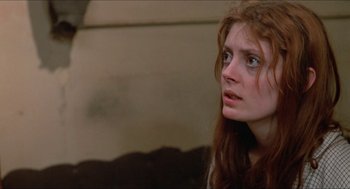 Movie still from “Joe” (1970), directed by John G. Avildsen – A person with long red hair; Close Up shot, Low angle