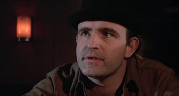 Movie still from “Joe” (1970), directed by John G. Avildsen – A person wearing a hat; Close Up shot, Low angle