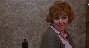 Movie still from “Joe” (1970), directed by John G. Avildsen – A person wearing a sweater; Close Up shot, Over the shoulder angle