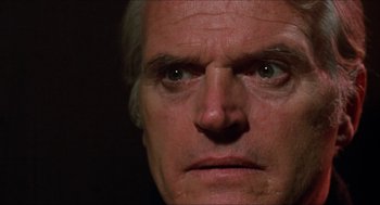 Movie still from “Joe” (1970), directed by John G. Avildsen – An older man's face is lit up by the sun; Close Up shot, Low angle